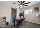 Stylish home office featuring a modern desk, custom barn door, and plenty of natural light at 9505 S Kenneth Pl, Tempe, AZ 85284