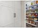 Walk-in pantry provides ample storage space with organized shelving and white cabinets at 9505 S Kenneth Pl, Tempe, AZ 85284