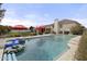 This beautiful backyard features a sparkling pool, grassy area, and mature landscaping at 9505 S Kenneth Pl, Tempe, AZ 85284