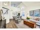 Well-lit living area with vaulted ceilings, an open floor plan, and wood flooring at 9652 E Ludlow Dr, Scottsdale, AZ 85260