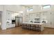 Modern, bright kitchen featuring white cabinetry, stainless steel appliances, and a large center island with bar seating at 10242 N 58Th St, Paradise Valley, AZ 85253