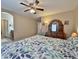 Bedroom with a ceiling fan and en-suite bathroom at 10323 W Carousel Dr, Arizona City, AZ 85123