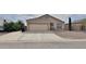 Charming single-story home featuring a two-car garage and low maintenance landscaping at 10323 W Carousel Dr, Arizona City, AZ 85123