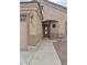 Inviting home entrance with a covered walkway and an oval glass paneled front door at 10323 W Carousel Dr, Arizona City, AZ 85123