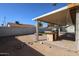 Backyard featuring an outdoor cooking area with a built-in grill at 10720 E Sahuaro Dr, Scottsdale, AZ 85259