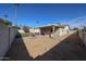 Large backyard featuring an outdoor cooking area and a built-in fire pit at 10720 E Sahuaro Dr, Scottsdale, AZ 85259