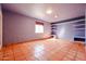 This bedroom has tile floors, natural light and recessed lighting at 10720 E Sahuaro Dr, Scottsdale, AZ 85259