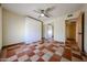 Bedroom featuring a ceiling fan, closet, and light-colored walls at 10720 E Sahuaro Dr, Scottsdale, AZ 85259