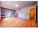 Spacious bedroom featuring tile floors, natural light and modern recessed lighting at 10720 E Sahuaro Dr, Scottsdale, AZ 85259