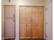 Storage closet with paneled bi-fold doors and additional cabinets at 10720 E Sahuaro Dr, Scottsdale, AZ 85259