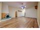 Large living room featuring decorative fireplace and wood floors for a warm and inviting atmosphere at 10720 E Sahuaro Dr, Scottsdale, AZ 85259