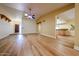 Spacious living room with wood floors and natural light at 10720 E Sahuaro Dr, Scottsdale, AZ 85259