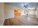 Spacious living room with wood floors offering seamless transition to other living spaces at 10720 E Sahuaro Dr, Scottsdale, AZ 85259