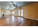 Open floor plan living area with wood floors and blue painted ceiling, offering a bright atmosphere at 10720 E Sahuaro Dr, Scottsdale, AZ 85259