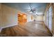 Spacious living room with wood floors featuring a seamless transition to other living spaces at 10720 E Sahuaro Dr, Scottsdale, AZ 85259