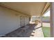 Covered patio area with an outdoor cooking area at 10720 E Sahuaro Dr, Scottsdale, AZ 85259