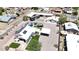 Aerial view of home showcasing a pool, spa, gazebo, RV parking, and metal roof in a desert landscape at 1102 E Brown St, Phoenix, AZ 85020