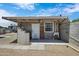 Backyard shed/unit with white cinderblock walls, white door, and covered awning at 1102 E Brown St, Phoenix, AZ 85020