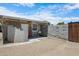 Backyard features a block wall, door to garage, and gravel yard at 1102 E Brown St, Phoenix, AZ 85020