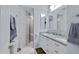 Modern bathroom with dual sinks, granite countertops, and tiled shower at 1102 E Brown St, Phoenix, AZ 85020