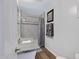 Bathroom featuring granite counters, tiled shower with curtain and wood floor at 1102 E Brown St, Phoenix, AZ 85020