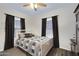 Bedroom with natural light, ceiling fan and blue accent ceiling at 1102 E Brown St, Phoenix, AZ 85020