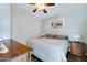 Cozy bedroom features ceiling fan, wood floor, neutral colors, and serene decor at 1102 E Brown St, Phoenix, AZ 85020