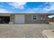 Spacious garage with white door and cinder block construction, perfect for storage or workshop at 1102 E Brown St, Phoenix, AZ 85020