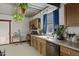 Well-lit kitchen showcasing wood cabinets, granite countertops, and stainless steel appliances at 1102 E Brown St, Phoenix, AZ 85020