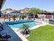 Poolside view of the pool, landscaping, and mountain views. Modern pool and outdoor space at 1102 E Brown St, Phoenix, AZ 85020