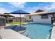 Backyard pool with blue umbrella surrounded by well-maintained landscaping and an outdoor gazebo at 1102 E Brown St, Phoenix, AZ 85020