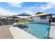 Beautiful pool with a waterfall feature, gazebo, and artificial turf landscaping for relaxation at 1102 E Brown St, Phoenix, AZ 85020