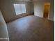 Spacious bedroom with neutral color and a large window for natural light at 11184 W Royal Palm Rd, Peoria, AZ 85345