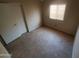 A bedroom with tile flooring, a window, and a closet at 11184 W Royal Palm Rd, Peoria, AZ 85345