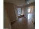 Bedroom with tile flooring, a window seat, and a ceiling fan at 11184 W Royal Palm Rd, Peoria, AZ 85345