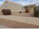 Tan single-story home featuring low maintenance desert landscaping at 11184 W Royal Palm Rd, Peoria, AZ 85345