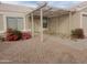 Home entrance with decorative pergola and low maintenance desert landscaping at 11184 W Royal Palm Rd, Peoria, AZ 85345