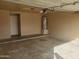 A garage with a hot water heater, concrete floors, and an automatic door opener at 11184 W Royal Palm Rd, Peoria, AZ 85345