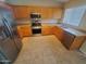 Well-lit kitchen featuring stainless steel appliances and ample counter space at 11184 W Royal Palm Rd, Peoria, AZ 85345