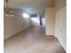 Bright and airy living room featuring tile floors and ceiling fans at 11184 W Royal Palm Rd, Peoria, AZ 85345