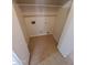 Walk-in closet with built-in shelving and connections for washer and dryer at 11184 W Royal Palm Rd, Peoria, AZ 85345