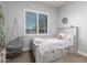 Bedroom with a hanging chair and a bed featuring drawers for extra storage at 11307 E Ellis St, Mesa, AZ 85207