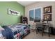 Comfortable bedroom featuring a neutral carpet, a window with shutters, and a desk, perfect for studying at 11307 E Ellis St, Mesa, AZ 85207