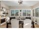 Dining room with a modern chandelier and large windows bringing in lots of sunlight at 11307 E Ellis St, Mesa, AZ 85207