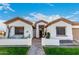 Charming single-story home featuring a well-manicured lawn and inviting front porch at 11307 E Ellis St, Mesa, AZ 85207