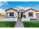 Charming single-story home featuring a well-manicured lawn and inviting front porch at 11307 E Ellis St, Mesa, AZ 85207