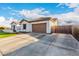 Well-maintained home with a spacious driveway leading to an attached two-car garage at 11307 E Ellis St, Mesa, AZ 85207