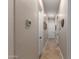 Hallway with neutral walls and decorative tile flooring at 11307 E Ellis St, Mesa, AZ 85207