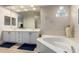 Main bathroom with double sinks and soaking tub at 11307 E Ellis St, Mesa, AZ 85207