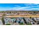 Stunning aerial view of neighborhood homes with private pools, desert landscaping and mountain backdrop at 1143 N Quinn --, Mesa, AZ 85205